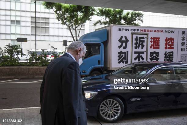 Noel Quinn, chief executive officer of HSBC Holdings Plc, departs an HSBC Holdings Plc informal shareholders meeting as a van displaying 'Spin off...