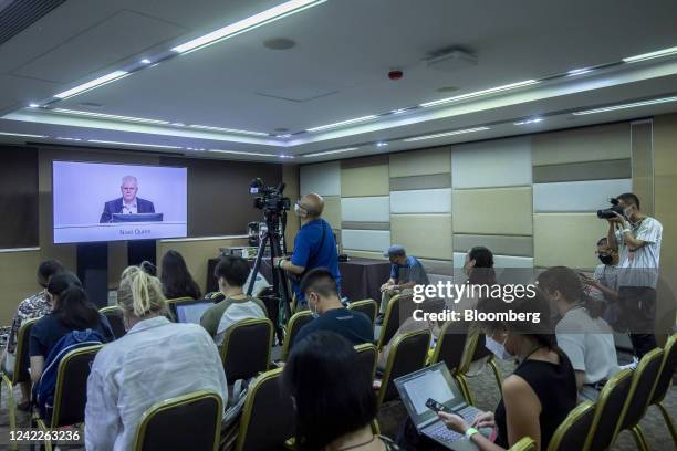 Members of the media watch a broadcast of Noel Quinn, chief executive officer of HSBC Holdings Plc, at an HSBC Holdings Plc informal shareholders...