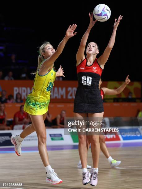 Wales' Ella Powell-Davies and Australia's Gretal Bueta during their women's netball match on day five of the Commonwealth Games at the NEC Arena in...