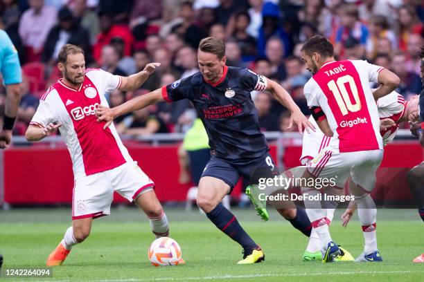 Luuk de Jong of PSV Eindhoven and Daley Blind of Ajax Amsterdam and Dusan Tadic of Ajax Amsterdam Battle for the ball during the Johan Cruijff Cup...