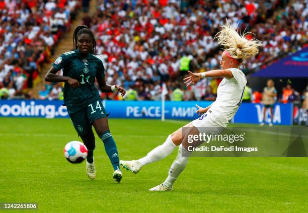 Nicole Anyomi of Germany and Chloe Kelly of England battle for the ball during the UEFA Women's Euro England 2022 final match between England and...