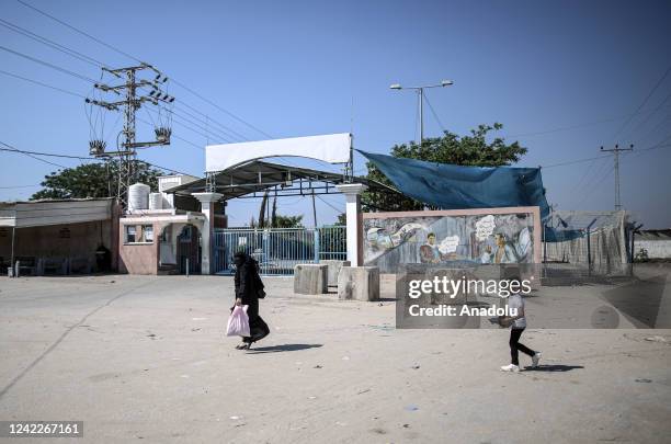Woman walks with her child on an empty street near the Erez crossing in Gaza City, Gaza on August 02, 2022. Israel closed the Erez crossing in the...