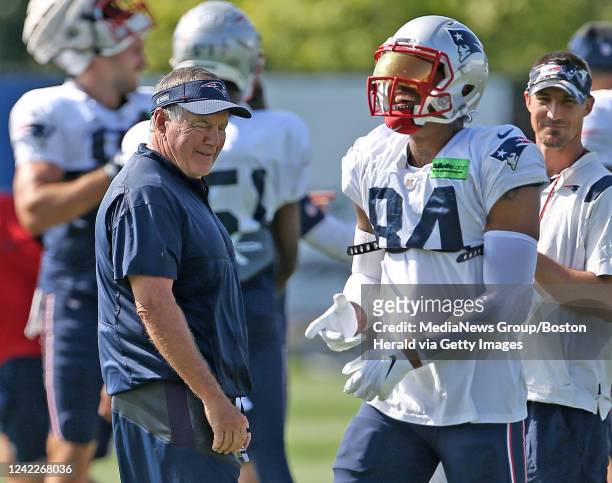 August 2: New England Patriots head coach Bill Belichick has a laugh with Kendrick Bourne during training camp at Gillette Stadium on August 2, 2022...