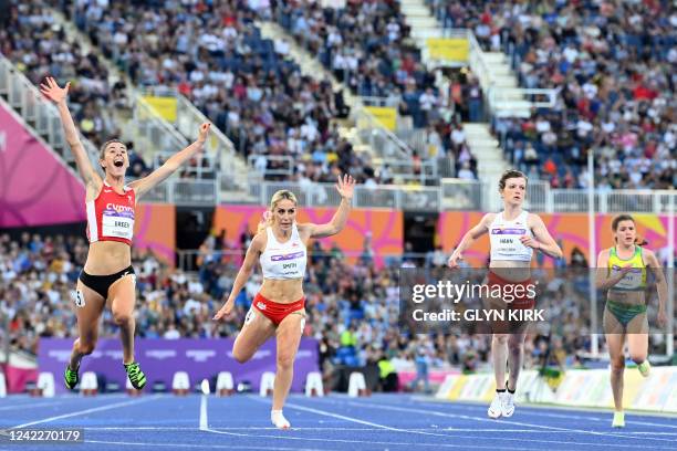 Wales' Olivia Breen celebrates next to England's Ali Smith as she wins the para-women's 100m T37/38 final athletics event at the Alexander Stadium,...