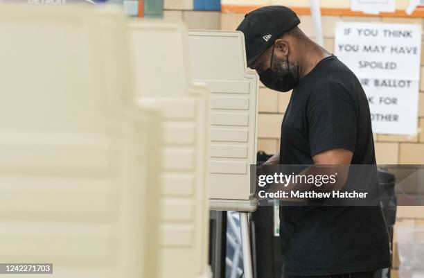 Michigan residents their ballots in the Michigan primary election on August 2, 2022 in Bloomfield Hills, Michigan. Among those running in this...