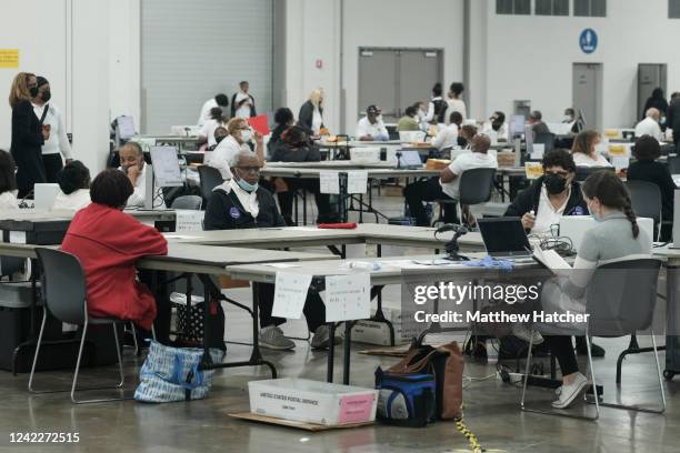 Detroit, MI Volunteers and pools workers work at the TCF Center where ballots are counted on August 2, 2022 in Detroit, Michigan. Among those running...