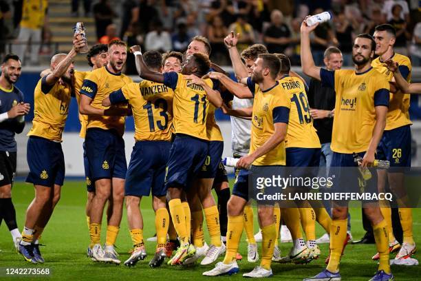 Union's players celebrate their victory at the end of the UEFA Champions League third qualifying round first leg football match between Rangers and...