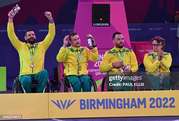 Gold medallist team Australia pose during the medal presentation ceremony for the para-men's wheelchair 3x3 basketball match on day five of the...