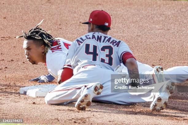 Jose Ramirez of the Cleveland Guardians is tagged out by Sergio Alcantara of the Arizona Diamondbacks attempting to stretch an RBI single into a...