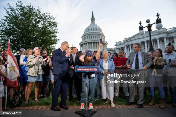 Senate Majority Leader Chuck Schumer applauds as Rosie Torres, wife of veteran Le Roy Torres who suffers from illnesses related to his exposure to...