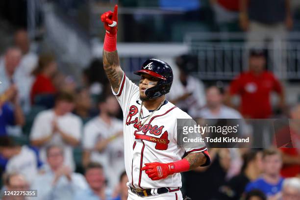 Orlando Arcia of the Atlanta Braves reacts after hitting a two run home run during the fifth inning against the Philadelphia Phillies at Truist Park...