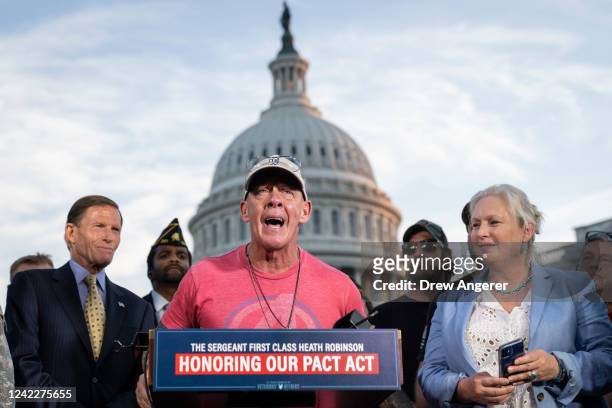 Flanked by Sen. Richard Blumenthal and Sen. Kirsten Gillibrand , activist John Feal speaks during a news conference with veterans and their families...