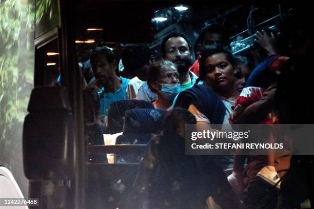 Migrants from Venezuela, who boarded a bus in Del Rio, Texas, disembark within view of the US Capitol in Washington, DC, on August 2, 2022. - Since...