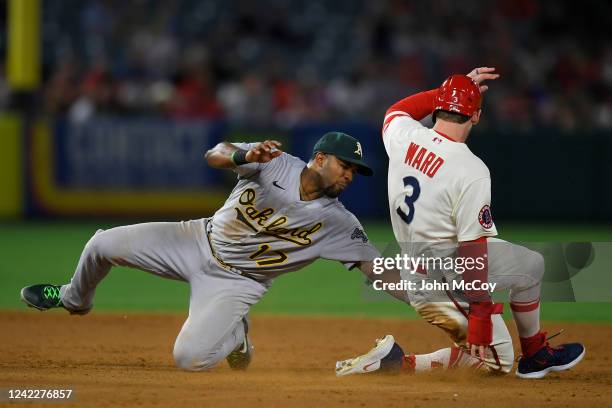 Elvis Andrus of the Oakland Athletics tags out Taylor Ward of the Los Angeles Angels trying to steal second base in the sixth inning at Angel Stadium...