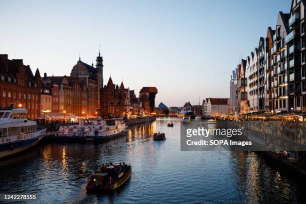 Tourist boats are riding the Motlawa river in the old town of Gdansk. Gdansk is one of the most popular tourist cities in Poland. The Guardian...