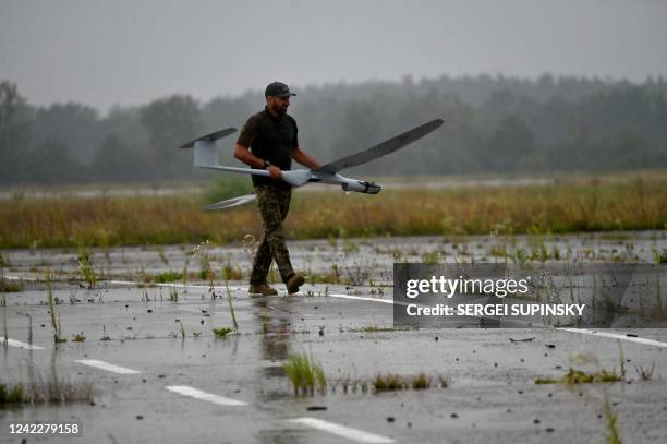 An military operator carries a FlyEye WB Electronics SA, a Polish reconnaissance drone, bought in the frame of the program 'The Army of Drones'...