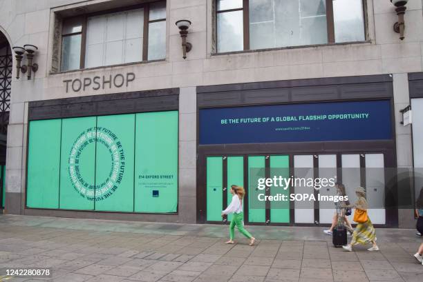 Pedestrians pass by the former Topshop, one of the many shops which have shut on Oxford Street. Numerous stores have been forced to close on London's...