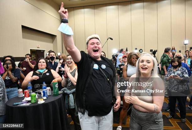 Jae Moyer, center, of Overland Park, and Allie Utley, of Allen County, Kansas cheered as the Kansans for Constitutional Freedom and supporters...