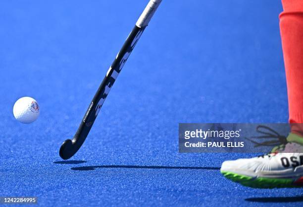 Canada's Alex Bird controls the ball during the men's pool B hockey match between Canada and India on day six of the Commonwealth Games at the...