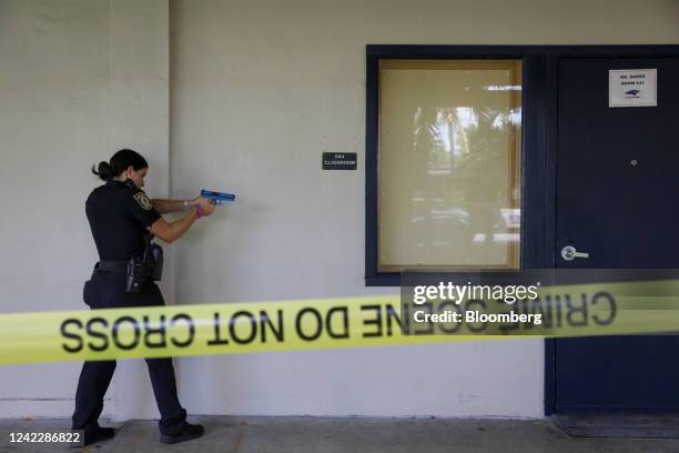 Police officer outside a classroom during a large-scale functional active shooter drill at Hialeah Senior High School in Hialeah, Florida, US, on...