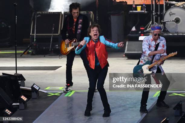 British rock band The Rolling Stones' singer Mick Jagger , guitarist Ron Wood and guitarist Keith Richards perform on stage during a concert as part...