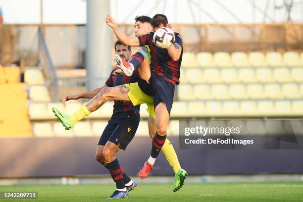 Sergio Postigo of UD Levante and Fer Nino of Villarreal CF controls the ball during the Pre-Season Friendly match between Villarreal CF and Levante...