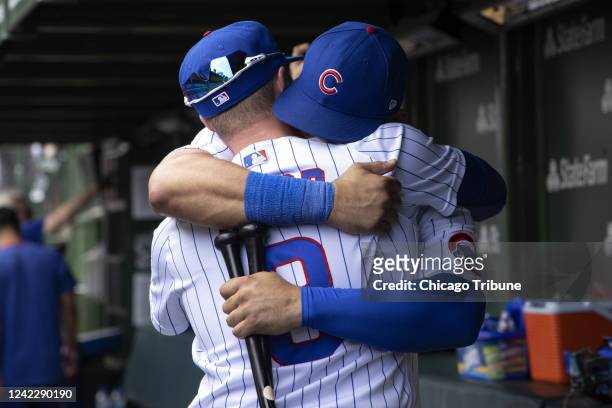 Chicago Cubs catcher Willson Contreras and left fielder Ian Happ share an emotional hug after the Cubs played the Pittsburgh Pirates Tuesday, July 26...