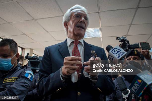 Guatemalan journalist Jose Ruben Zamora, president of the newspaper El Periodico, speaks to the press after a hearing at the Justice Palace in...