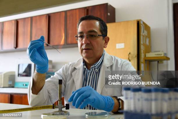 Ecuadorian scientist Javier Carvajal speaks during an interview with AFP at a laboratory of the Faculty of Exact Sciences of the Pontifical Catholic...