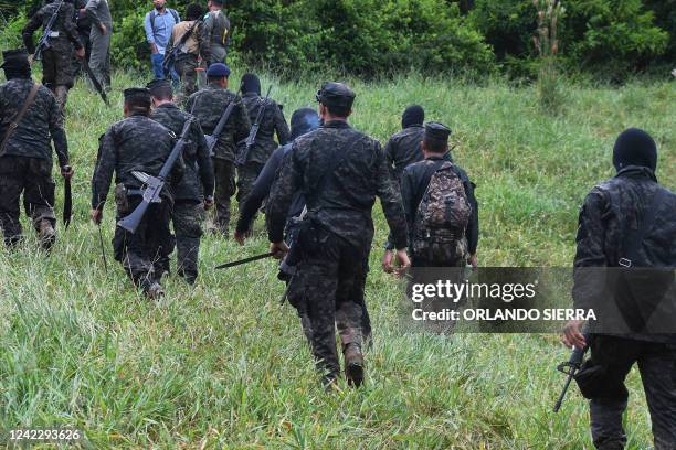 Soldiers, members of the Technical Criminal Investigation Agency and members of the Directorate for the Fight against Drug Trafficking destroy at...