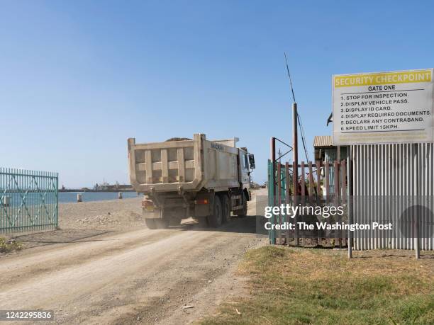Truck enters the security gate at Leroy Wharf, a port outside Honiara that some opposition leaders and experts think could be used by China as a de...