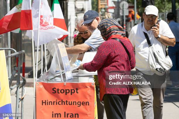 Members of the democratic Iranian opposition group NCRI protest against the Iranian regime nearby the Coburg Palais, the venue of the Joint...