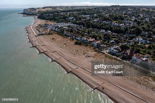 Beachfront houses are pictured on August 3, 2022 in Kingsdown, United Kingdom. A recent report has stated that around four thousand homes along the...