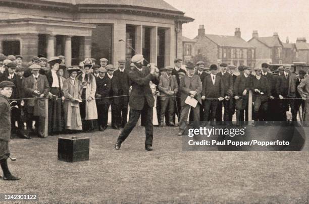 Vintage photograph featuring Scottish professional golfer James Braid, winner of The British Open Championship, teeing off at the first hole at...