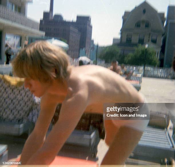 English multi-instrumentalist and founder of the Rolling Stones, Brian Jones sits by the band's motel pool before their show at the Asbury Park...