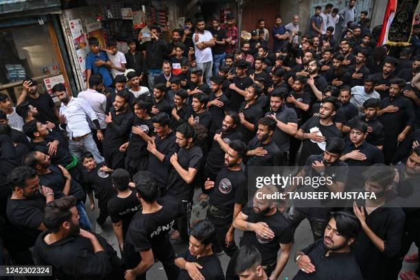 Shiite Muslim mourners take part in a Muharram procession on the fifth day of Ashura, in Srinagar on August 4, 2022. - Ashura is a period of mourning...