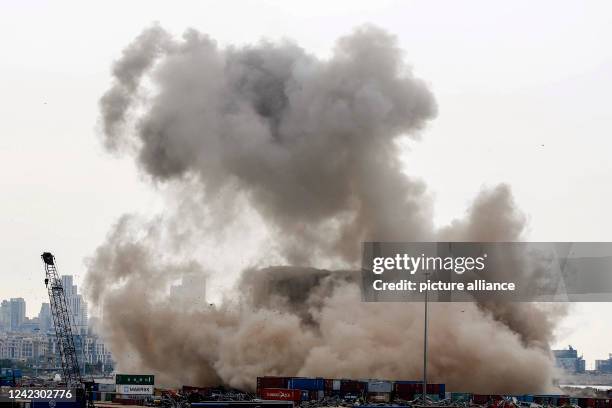 August 2022, Lebanon, Beirut: Heavy smoke billows after a huge part of Beirut port silos collapsing, as Lebanese marked the 2nd anniversary of the...