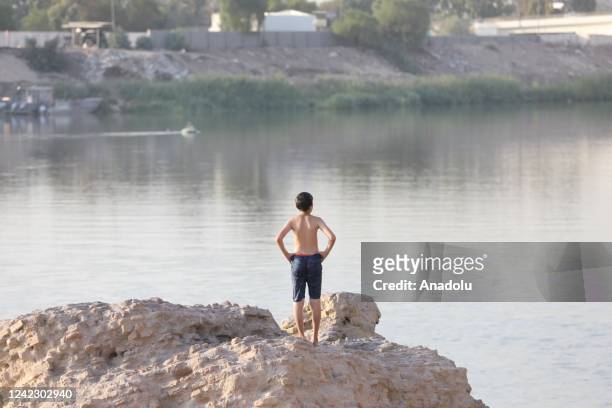 People cool off at Tigris River during hot weather in Baghdad, Iraq on August 04, 2022.