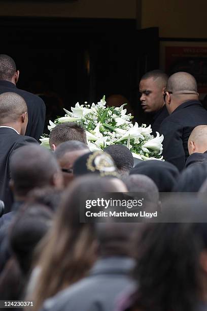 Friends and family carry the coffin of Mark Duggan into the New Testament Church of God in Wood Green on September 9, 2011 in London, England. Mark...