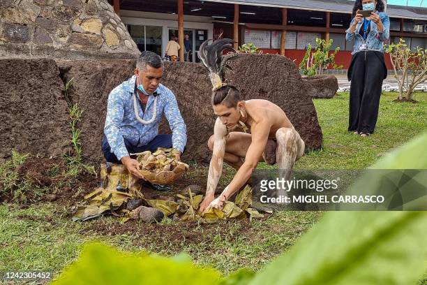 Personnel of the Mataveri international airport perform a ceremony to Mother Earth while waiting for tourists to arrive in Hanga Roa, Easter Island,...