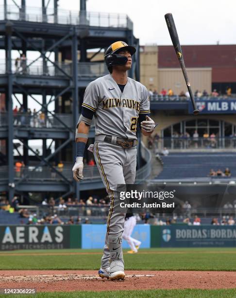 Christian Yelich of the Milwaukee Brewers flips his bat after being called out on strikes in the third inning during the game against the Pittsburgh...