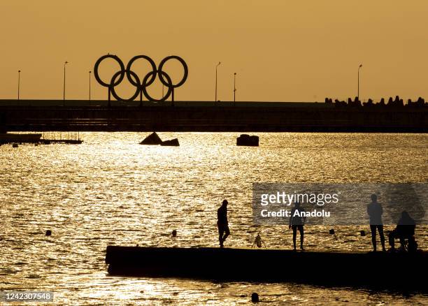 View of sunset painting the sky yellow in the Black Sea coastal city of Sochi, Russia on August 04, 2022.