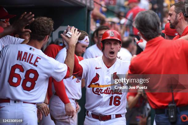 Nolan Gorman of the St. Louis Cardinals is congratulated after hitting a solo home run against the Chicago Cubs in the seventh inning in game one of...