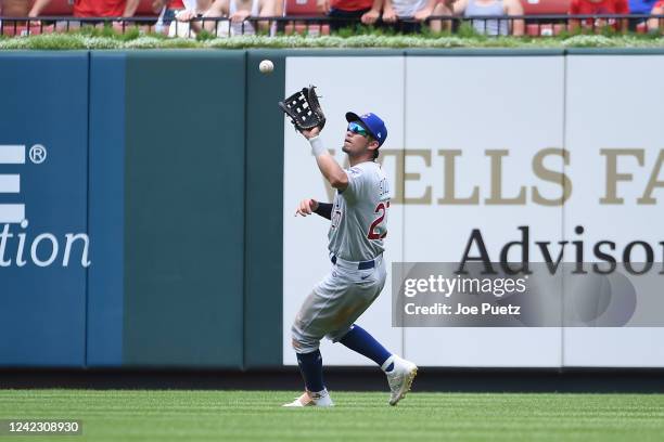 Seiya Suzuki of the Chicago Cubs catches a fly ball by the St. Louis Cardinals in the eighth inning in game one of a double header at Busch Stadium...