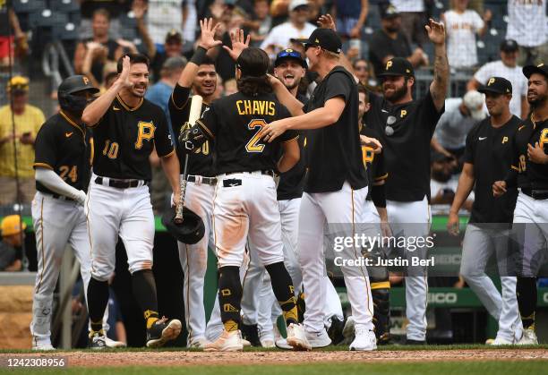 Members of the Pittsburgh Pirates celebrate after a walk-off 5-4 win over the Milwaukee Brewers during the game at PNC Park on August 4, 2022 in...