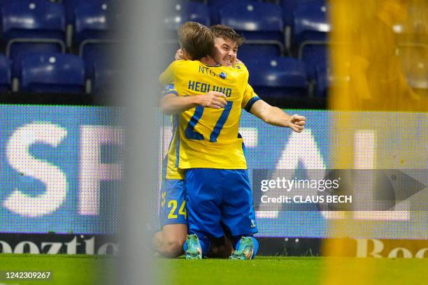 Brondby's Croatian forward Marko Divkovic and Brondby's Swedish forward Simon Hedlund react after scoring a goal during the UEFA Europa Conference...