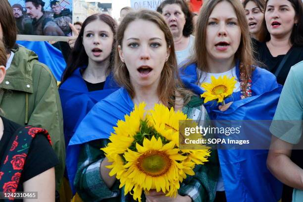 Woman shouts slogans during a protest in support of the soldiers of the Azov battalion, who were tortured by the Russian military on July 29, 2022 at...