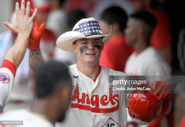 Mickey Moniak of the Los Angeles Angels is congratulated for his home run in the ninth inning against the Oakland Athletics at Angel Stadium of...