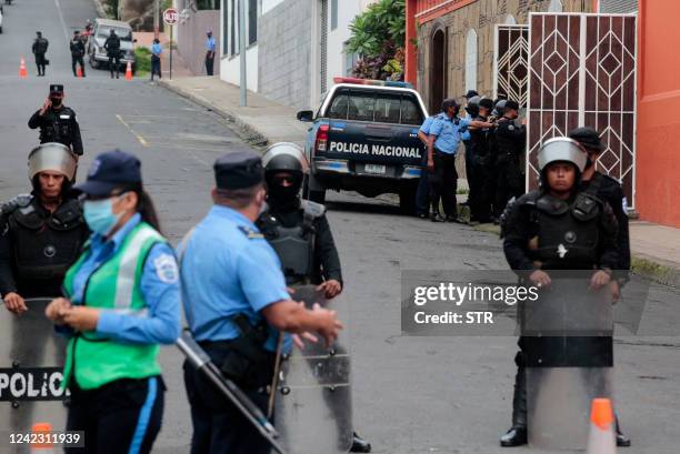 Police officers and riot police block the main entrance of Matagalpa's Archbishop Curia preventing Monsignor Rolando Alvarez from leaving, in...