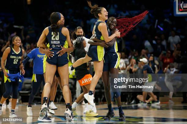 Veronica Burton celebrates with Awak Kuier of the Dallas Wings after the game against the Las Vegas Aces on August 4, 2022 at the College Park Center...